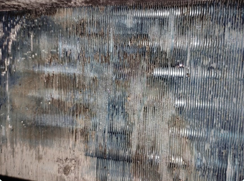 Close-up of coil fins with visible residue deposits