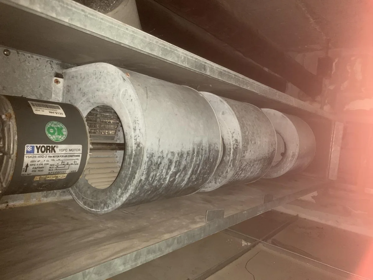 FCU blower motor and wheel with accumulated deposits before cleaning
