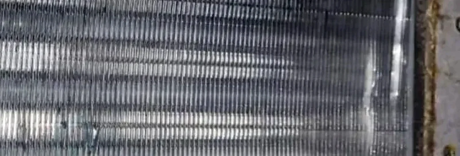 AC coil after cleaning showing improved visible condition