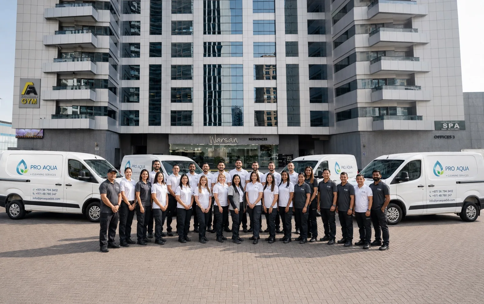 Pro Aqua Dubai team with branded service vans outside a Dubai residence