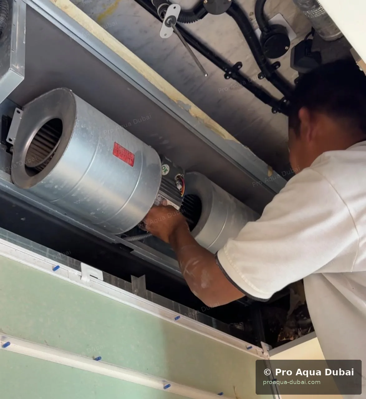 AC coil being cleaned by Pro Aqua technician — Dubai 2025